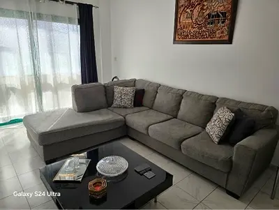 Grey L-shaped Fabric Corner Sofa from United Furniture — Good Condition