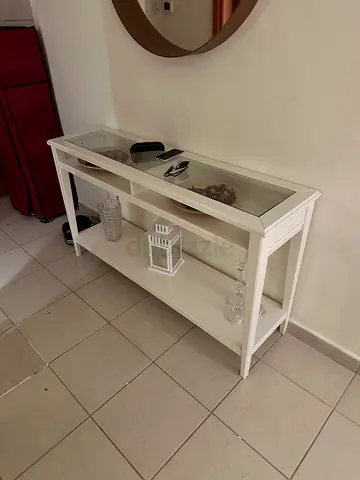 White glass-top console table with shelf