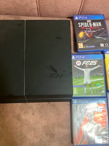 Sony PlayStation 4 Console with 5Games