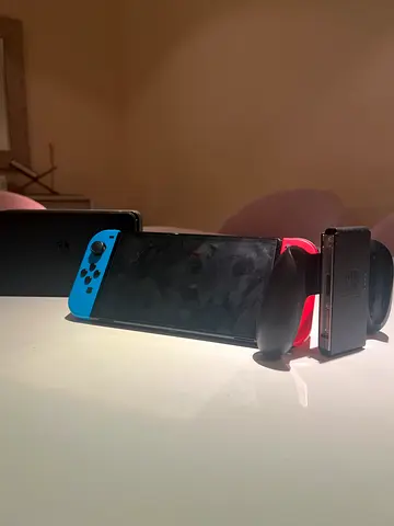 Nintendo Switch oled Console with Neon Blue and Red Joy-Cons and Charging Grip negotialble