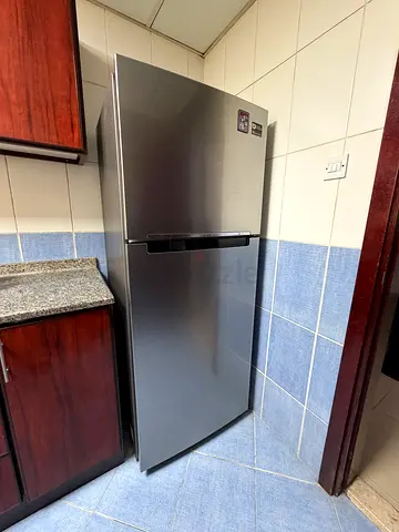 Used stainless steel top-freezer refrigerator - good condition