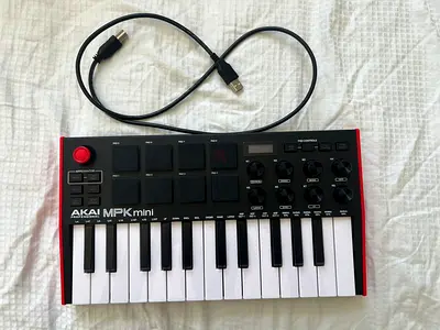 Akai Professional MPK Mini (MIDI keyboard controller) + USB cable
