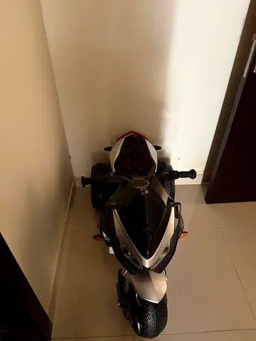 Electric ride-on toy motorcycle for kids