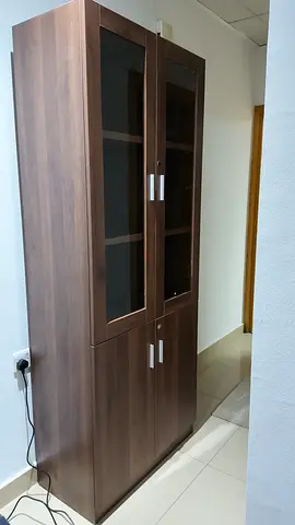 Tall wooden storage cabinet with glass doors - excellent condition - 2 pieces available