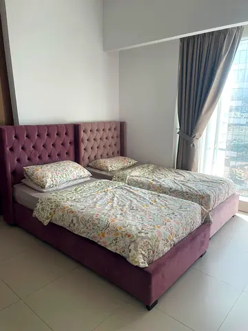 Pair of upholstered single beds with tufted headboards - good condition