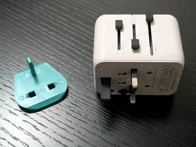 Compact Universal Travel Power Adapter with UK Plug Insert