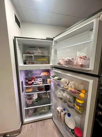 Used double-door refrigerator with top freezer - good working condition