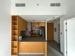 One room and living room with appliances
