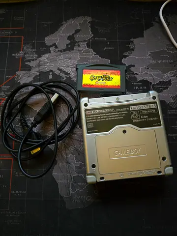 Original Nintendo GameBoy Advance SP (silver) with cables and game cartridge