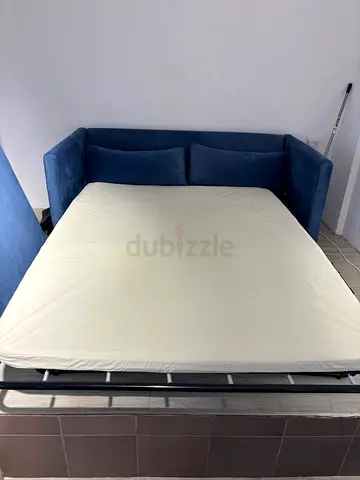 Blue fabric sofa bed - pull-out guest bed, excellent condition