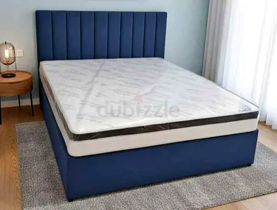 Blue upholstered double bed frame with mattress included