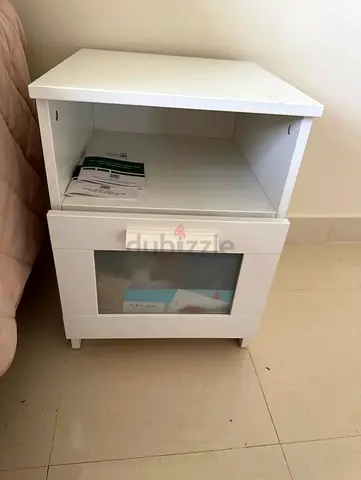 2 White bedside table with drawer and shelf - good condition price negotiable