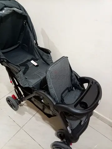 Grey standard baby stroller in good condition with tray and canopy