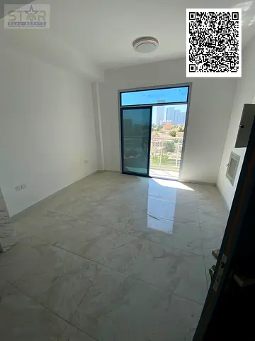 New building, first occupant, one-bedroom apartment with a living room, one bathroom, with a balcony, Al Rashidiya 3, opposite the Ladies' Park