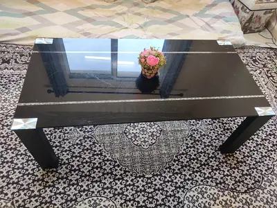 Black Glass Top Coffee Table with Metal Accents