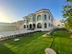 Luxury villa for rent in Al Jurf, Ajman. 7 bedrooms, private pool, spacious yard and covered parking