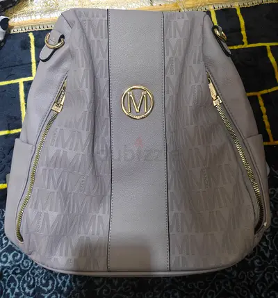 Light grey Marco monogram backpack with gold hardware