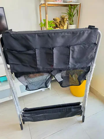 Portable baby changing station with storage pockets — excellent condition. Im giving this for free.