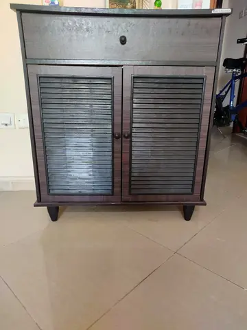 Small dark wood cabinet with drawer and louvered doors - good condition
