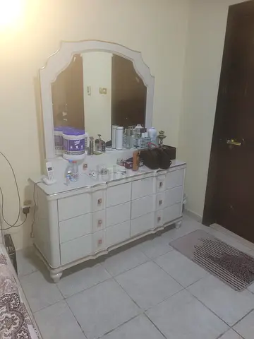 White vintage-style dresser with attached mirror