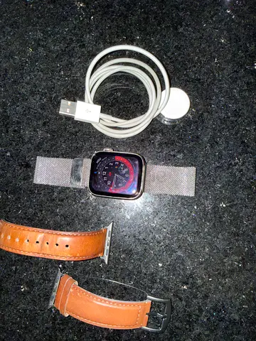 Apple Watch with charger and extra leather straps - good condition - original loop.
