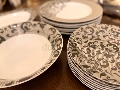 Set of 12 Decorative Dinner Plates and Bowls - Good Condition