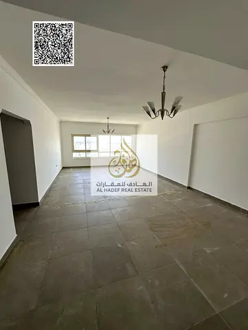 Two-bedroom apartment with a living room for annual rent, including parking and one month free. Largest area in Ajman.