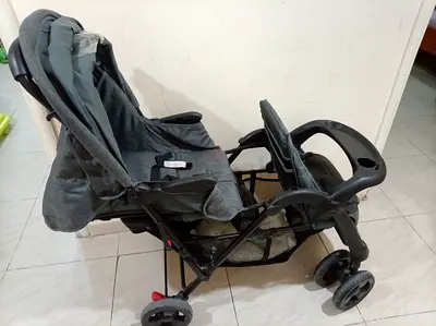 Grey standard baby stroller in good condition with tray and canopy