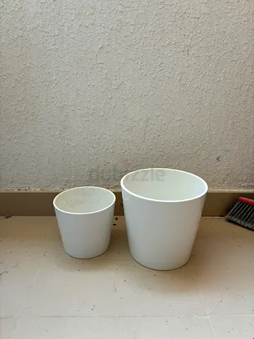 Two minimalist white ceramic flower pots