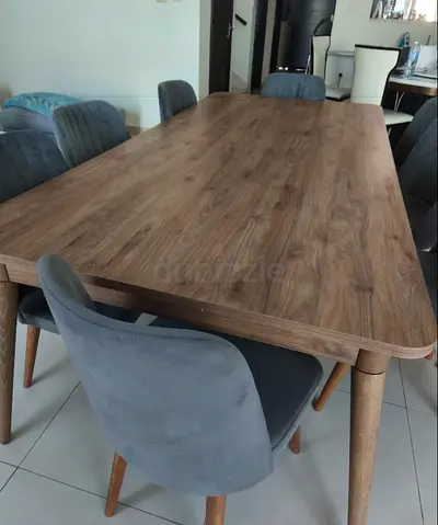 Solid wood dining table with 8 upholstered chairs - excellent condition