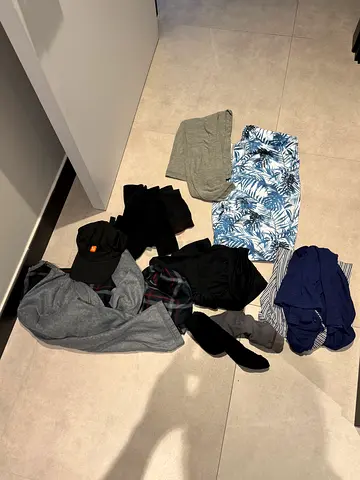 Mixed casual clothing lot — shirts, shorts, socks (used)