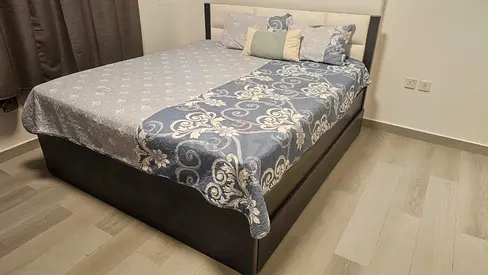 Queen storage bed with headboard — good condition