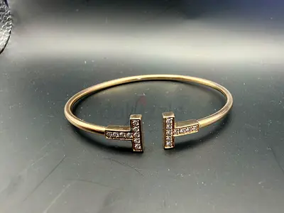 TiffanyCo ( not authentic) 18k rose Gold-open cuff bracelet with diamonds
