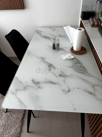 Small white marble-effect dining table with 4 chairs