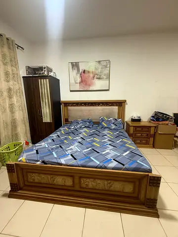 Wooden double bed set with side table and dresser