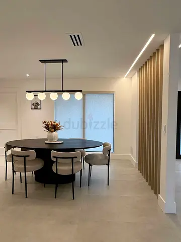 Modern round dining table with 6 upholstered chairs