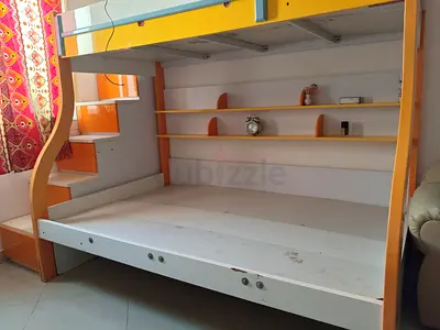 Bunk bed with built-in shelves and staircase - good condition