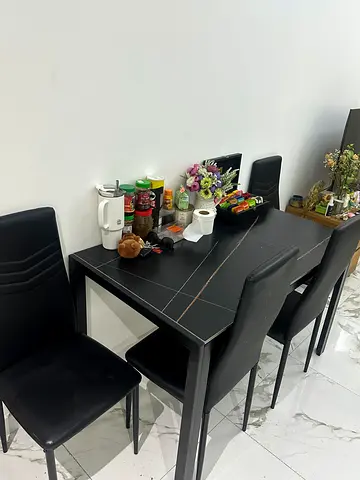 Modern black dining table with 4 chairs - good condition from Pan Home