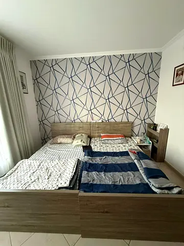 2 single wooden bed frame with built-in headboard storage - good condition