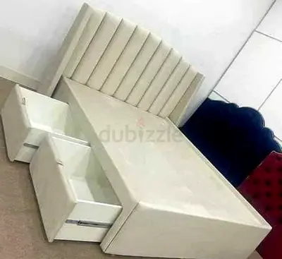 Cream upholstered storage bed with headboard and built-in drawers