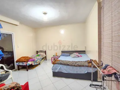 Spacious Furnished bed space in large room with Balcony Near WTC Mall  Corniche -Room mate
