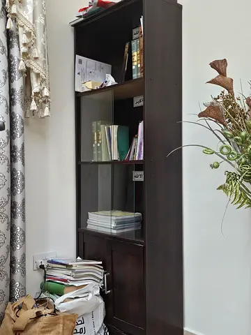 Dark wood bookcase with glass shelves and storage cabinet - good condition