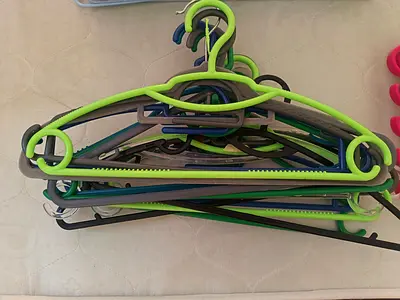 Set of plastic clothes hangers - assorted colors, lightweight (aprox 15)