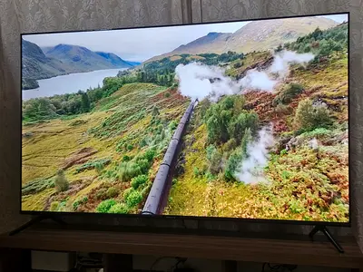 70-inch Smart LED TV UHD in excellent condition with steel stand