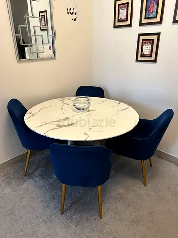 Round solid marble dining table with 4 blue velvet chairs