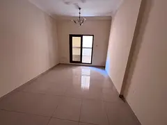 Distinctive Apartment in Al Rawda 1 | Master Bedroom and Balcony in a Modern Building