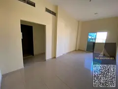 A room and a hall for annual rent in Al Rawda 1 - Ajman | A balcony and a great location, close to a