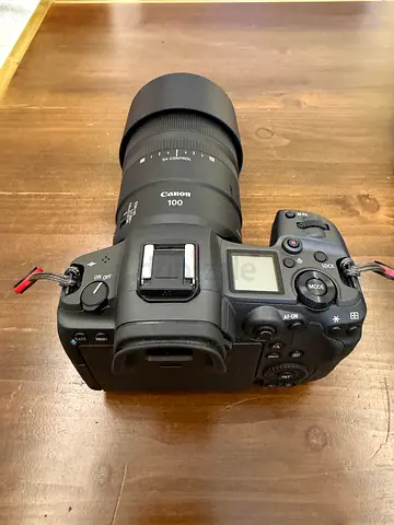 Canon EOS R5 mirrorless camera with 100mm lens — good condition