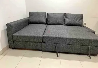 Grey L-shaped Sofa Bed with Storage - Good Condition