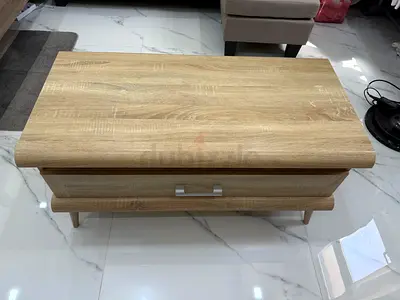 Wooden coffee table with storage drawer — light oak finish